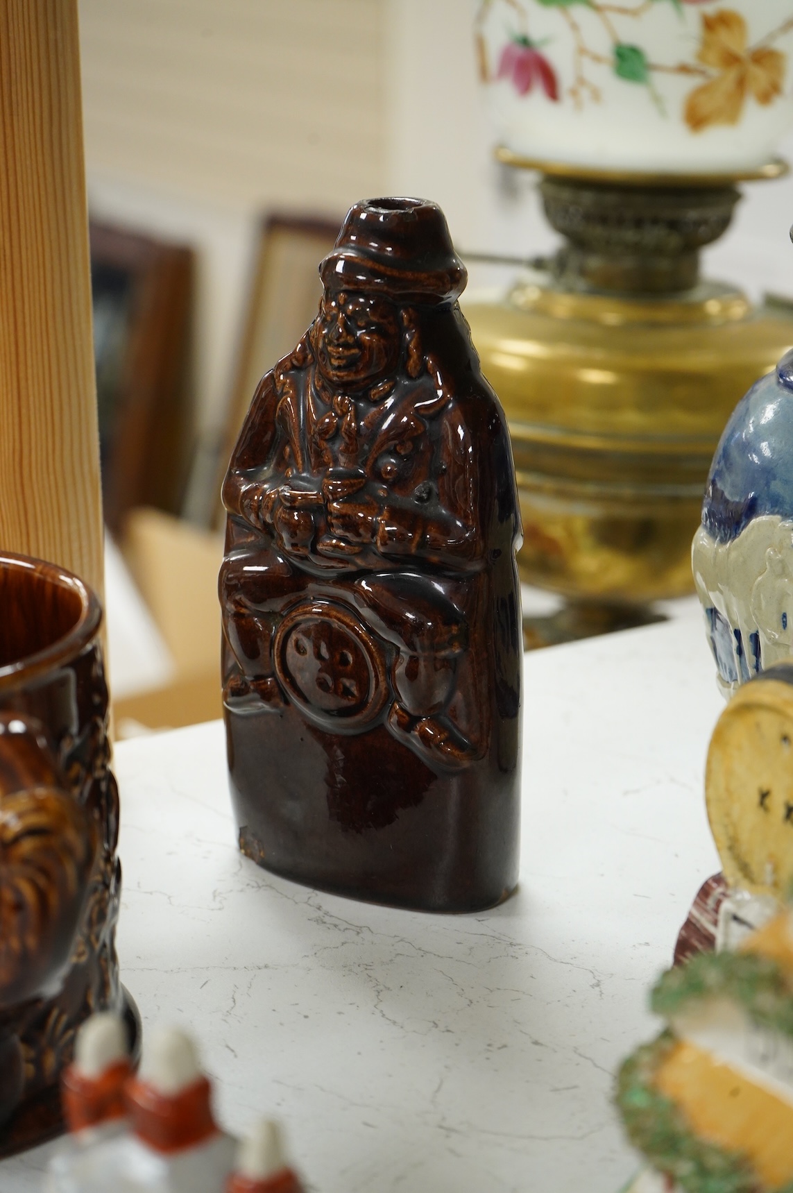 A group of various Victorian Staffordshire pottery models of cottages and various figure moulded vessels together with an Italian maiolica ewer, tallest 25cm